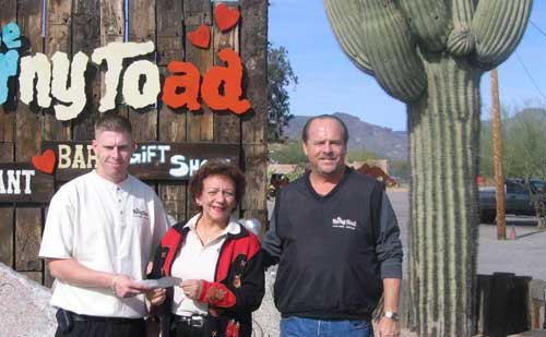 horny toad gives check to food bank