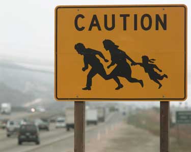 illegal crossing sign