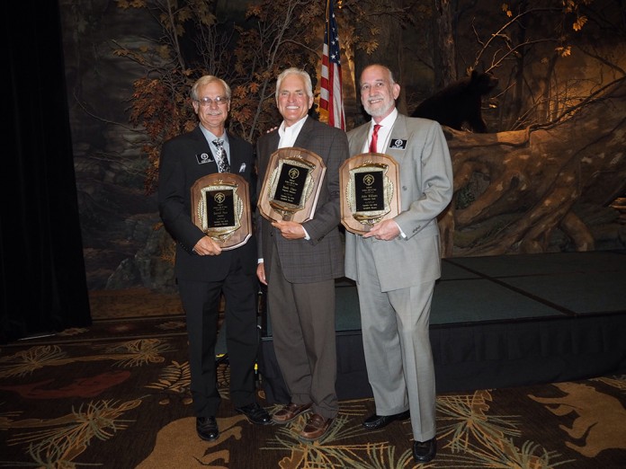 Dr. Randy Ulmer, center, was inducted into the Archery Hall of Fame in Springfield, Missouri